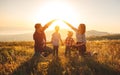 Happy family: mother, father, children son and daughter on sunset Royalty Free Stock Photo