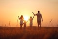 Happy family: mother, father, children son and daughter on sunset AI generated Royalty Free Stock Photo