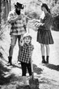 Happy family: mother, father, children son on spring garden background. Portrait of family of farms working in garden Royalty Free Stock Photo