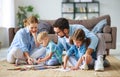 Happy family mother father and kids draw together at home Royalty Free Stock Photo