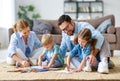 Happy family mother father and kids draw together at home Royalty Free Stock Photo