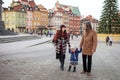 Happy Family - mother, father and little girl walking in autumn city and having fun Royalty Free Stock Photo