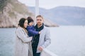 Happy family -mother, father and little son- walking in harbour Royalty Free Stock Photo