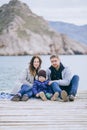 Happy family -mother, father and little son- walking in harbour Royalty Free Stock Photo