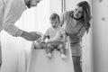 Happy family, mother and father playing with a son at home. Black and white photo Royalty Free Stock Photo