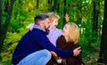 Happy family. Mother, father and son on autumn walk in park. Parents and child relaxing together in sunny day. Royalty Free Stock Photo