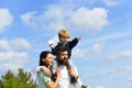 Happy family - mother, father and son on sky background in summer. Freedom to Dream - Joyful Boy Playing With Paper Royalty Free Stock Photo