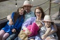 Happy family- mother,father and three children daughter relaxes on outdoor terrace of summer restaurant Royalty Free Stock Photo