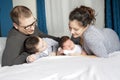 Happy family mother, father and two children at home in bed Royalty Free Stock Photo