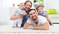 happy family mother, father and two children playing and cuddling at home Royalty Free Stock Photo