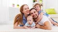 happy family mother, father and two children playing and cuddling at home Royalty Free Stock Photo