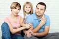 Happy family mother, father and two children playing and cuddling at home on floor Royalty Free Stock Photo