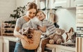 Happy family mother housewife and child in laundry with washing machine