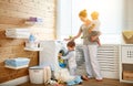 Happy family mother housewife and children in laundry load w