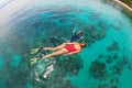 Mother, kid in snorkeling mask dive underwater with tropical fishes Royalty Free Stock Photo