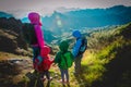 Happy family -mother with kids- travel in sunset mountains