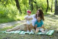 Happy family. Mother with the little daughter and the son have a Royalty Free Stock Photo