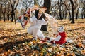 Happy family mother and little toddler baby daughter having fun together in autumn picnic Royalty Free Stock Photo