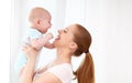 Happy family mother playing with baby Royalty Free Stock Photo