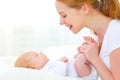 Happy family mother playing with newborn baby Royalty Free Stock Photo