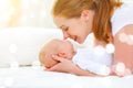 Happy family mother playing with newborn baby Royalty Free Stock Photo