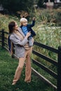 Happy family. Mother with son child playing having fun together on the grass in sunny summer day. Life moment Royalty Free Stock Photo