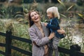 Happy family. Mother with son child playing having fun together on the grass in sunny summer day. Life moment Royalty Free Stock Photo