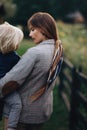 Happy family. Mother with son child playing having fun together on the grass in sunny summer day. Life moment Royalty Free Stock Photo