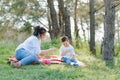 Happy family! Mother with son child playing having fun together on the grass in sunny summer day, life moment Royalty Free Stock Photo