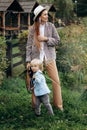 Happy family. Mother with son child playing having fun together on the grass in sunny summer day. Life moment Royalty Free Stock Photo