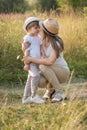 Happy family mother and son enjoying walk together at meadow in summer Royalty Free Stock Photo