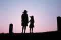 Happy family. A mother and son playing in grass fields outdoors at evening silhouette.Vintage Tone and copy space Royalty Free Stock Photo