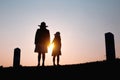 Happy family. A mother and son playing in grass fields outdoors at evening silhouette.Vintage Tone and copy space Royalty Free Stock Photo