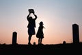 Happy family. A mother and son playing in grass fields outdoors at evening silhouette.Vintage Tone and copy space Royalty Free Stock Photo