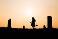 Happy family. A mother and son playing in grass fields outdoors at evening silhouette.Vintage Tone and copy space Royalty Free Stock Photo