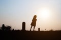 Happy family. A mother and son playing in grass fields outdoors at evening silhouette.Vintage Tone and copy space Royalty Free Stock Photo