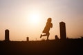 Happy family. A mother and son playing in grass fields outdoors at evening silhouette.Vintage Tone and copy space Royalty Free Stock Photo