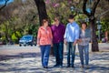 Family mother, sons and grandmother in the park