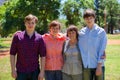 Family mother, sons and grandmother in the park