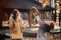 Happy family mother and teen boy son having fun with cocker spaniel puppy in autumn park Royalty Free Stock Photo