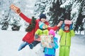 a happy family. mother and three children playing in the winter forest. Royalty Free Stock Photo