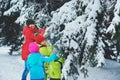 a happy family. mother and three children playing in the winter forest. Royalty Free Stock Photo