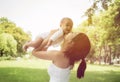 Happy family, Mother throws baby up, laughing and playing in the summer in the park Royalty Free Stock Photo