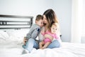 Happy family mother and two children, son and daughter in bed Royalty Free Stock Photo