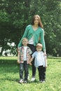 Happy family! Mother with two children sons walks on nature Royalty Free Stock Photo