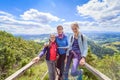 Happy family - mother and two daughters - on a hiking trip to the mountains Royalty Free Stock Photo