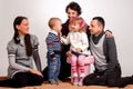 Happy family. Mothers women and kids little girl and boys sittin Royalty Free Stock Photo