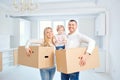 A happy family moves to a new apartment. Royalty Free Stock Photo