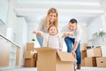 A happy family moves to a new apartment. Royalty Free Stock Photo