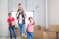 Happy family with moving boxes in their house Royalty Free Stock Photo